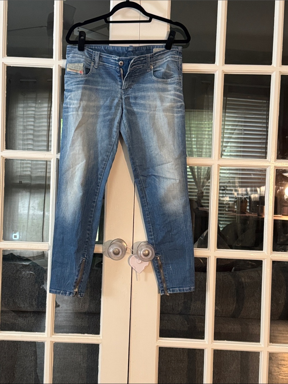 Womenβs Light Blue Washed Jeans with Ankle Zips
